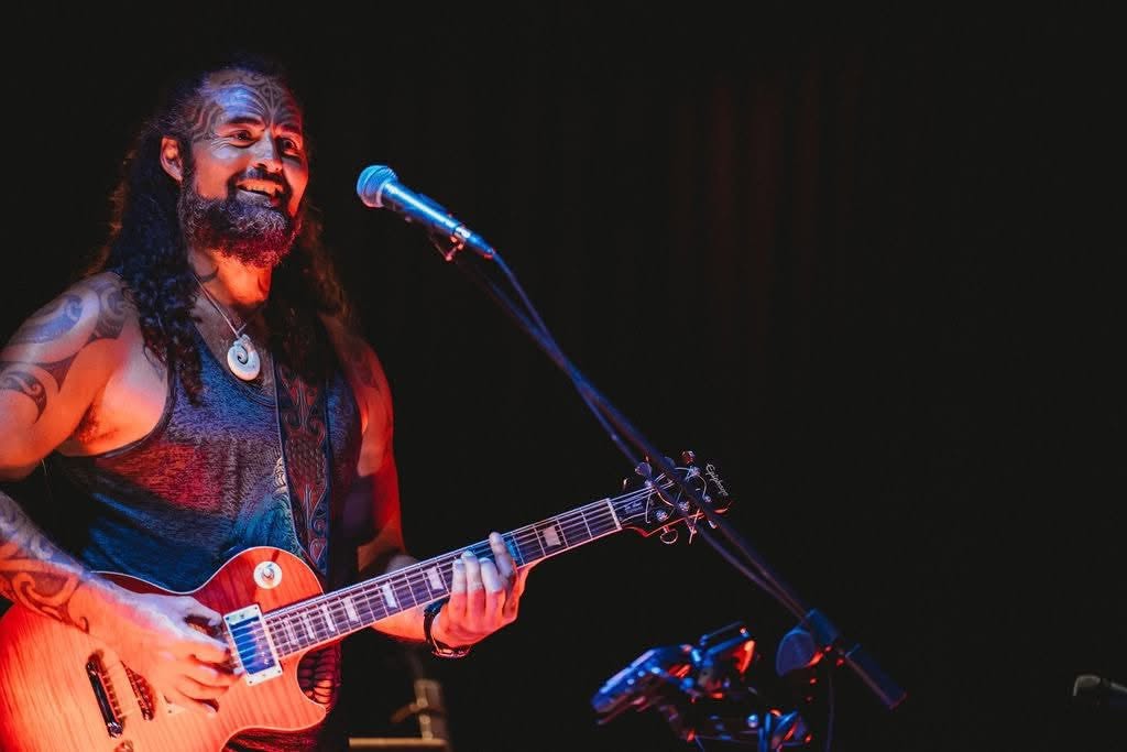 A guitarist performing live at Raumati Social Club